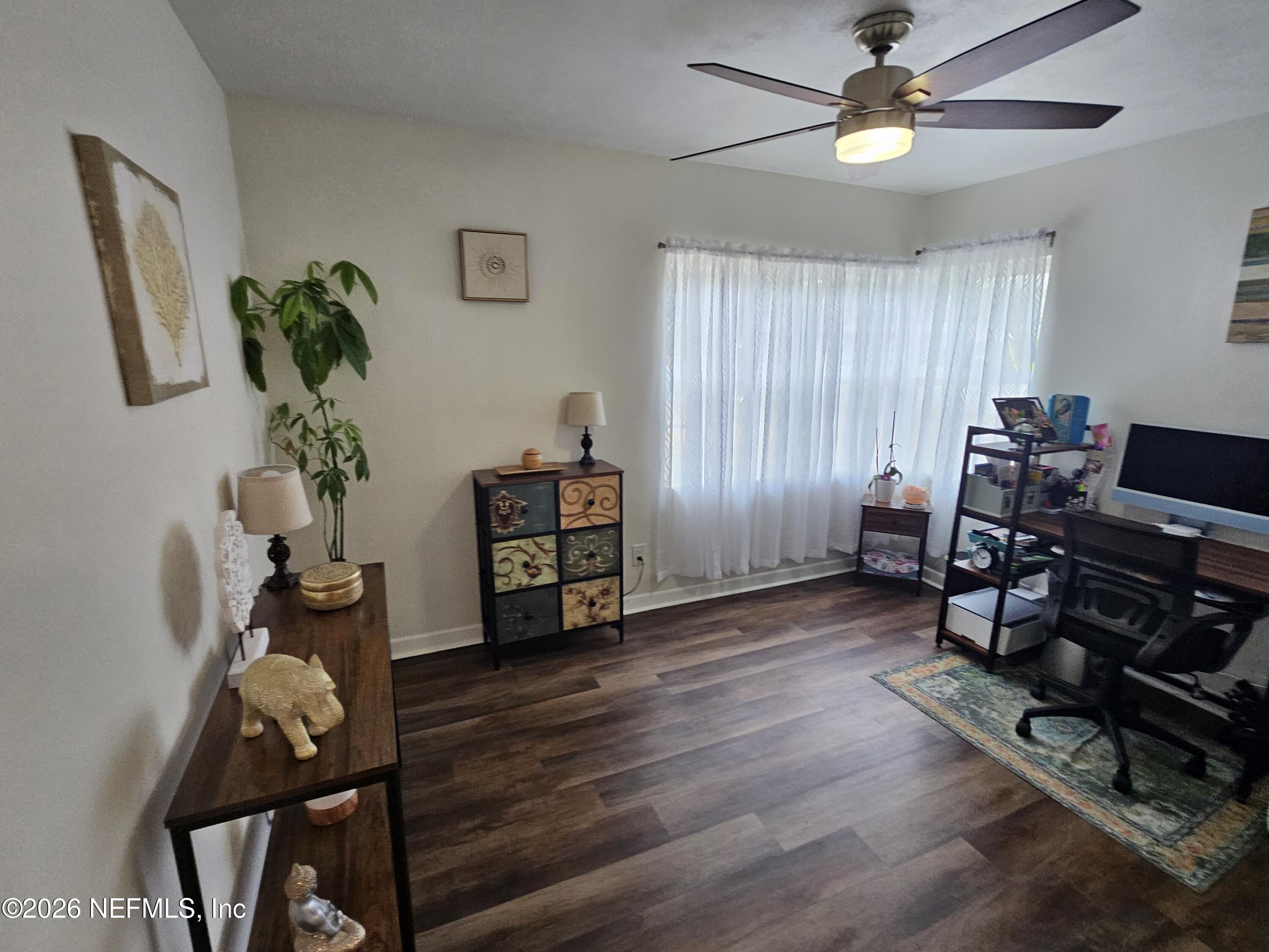7269 Balboa Road Jacksonville, FL 32217 - Photo 15 of 24 a view of a workspace with furniture and a window