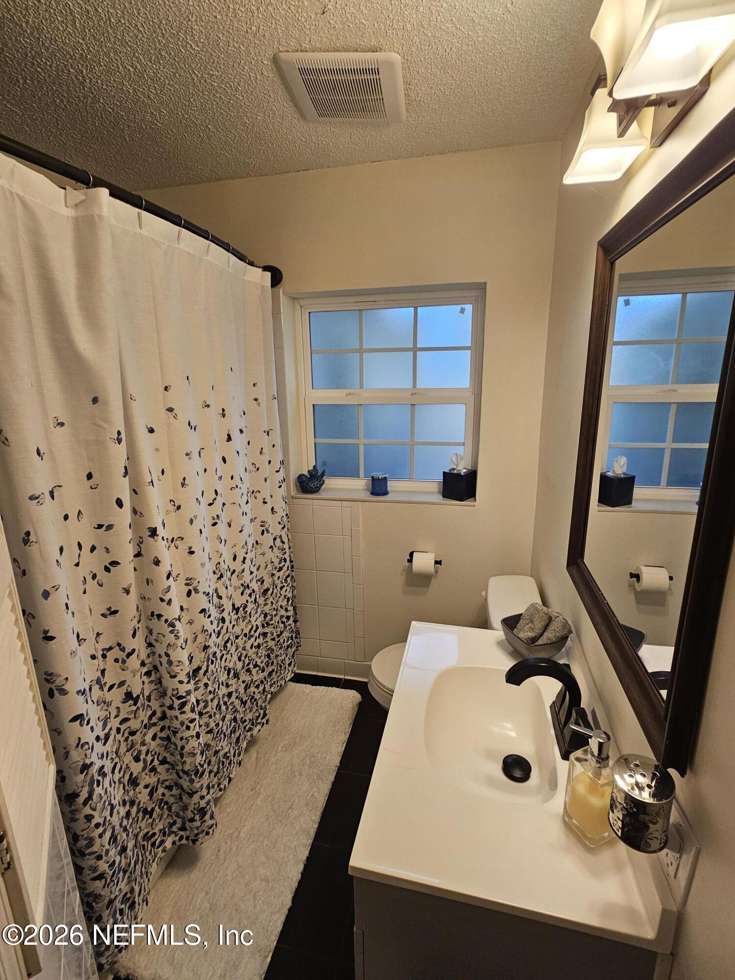 7269 Balboa Road Jacksonville, FL 32217 - Photo 16 of 24 a bathroom with a sink and a tub