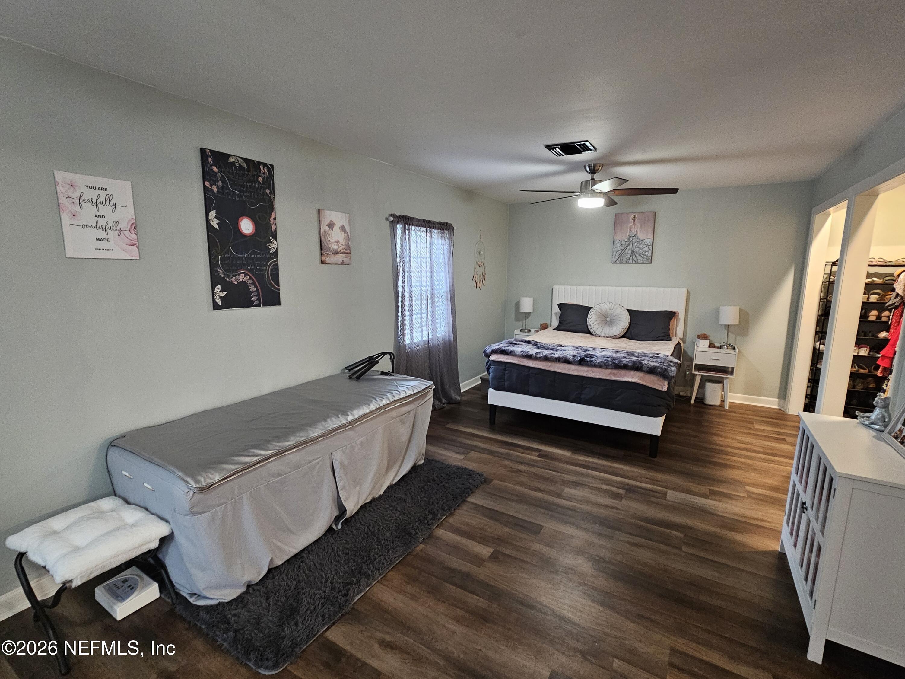 7269 Balboa Road Jacksonville, FL 32217 - Photo 18 of 24 a spacious bedroom with a bed and a couch