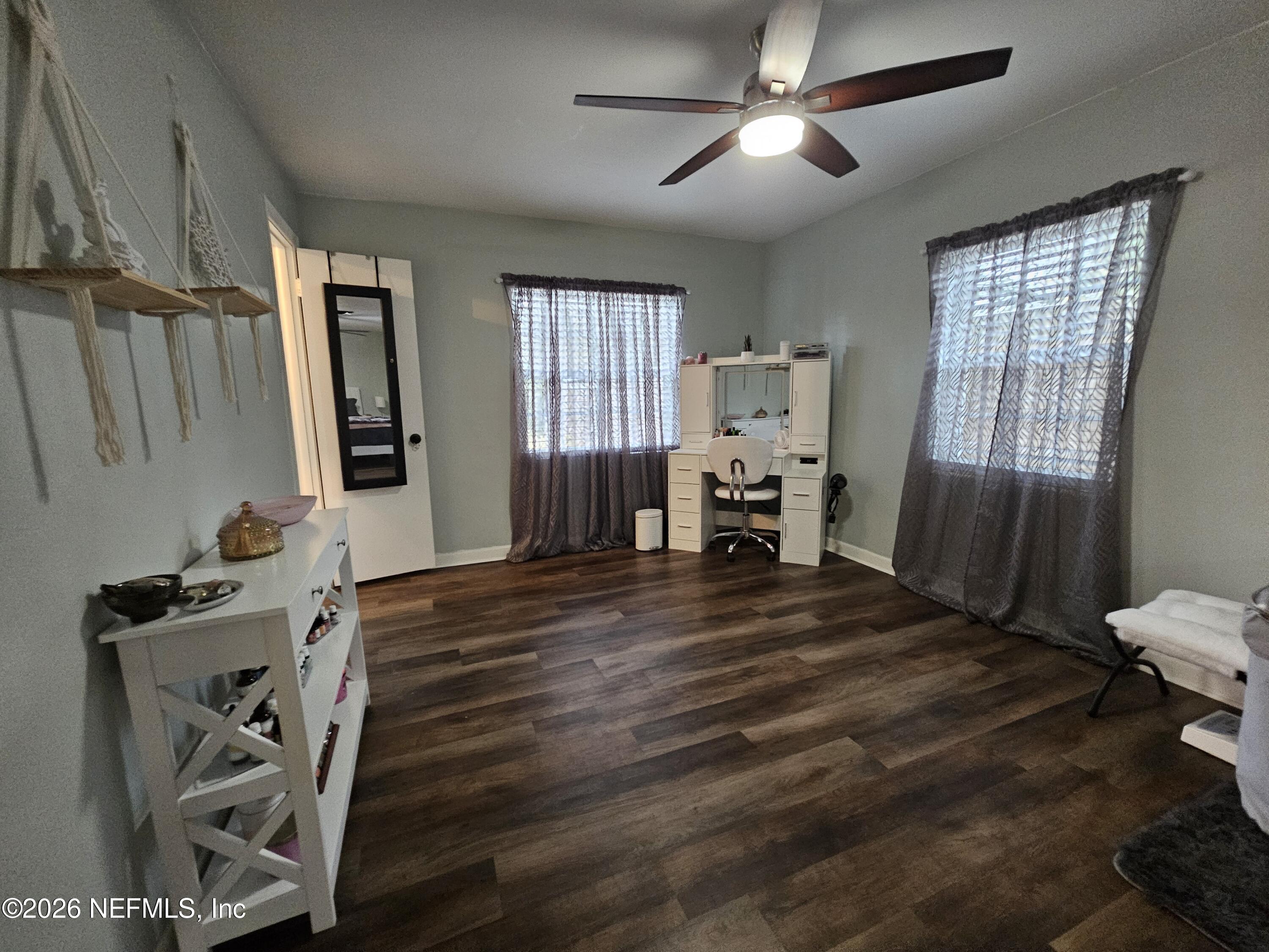 7269 Balboa Road Jacksonville, FL 32217 - Photo 19 of 24 a bedroom with furniture and wooden floor