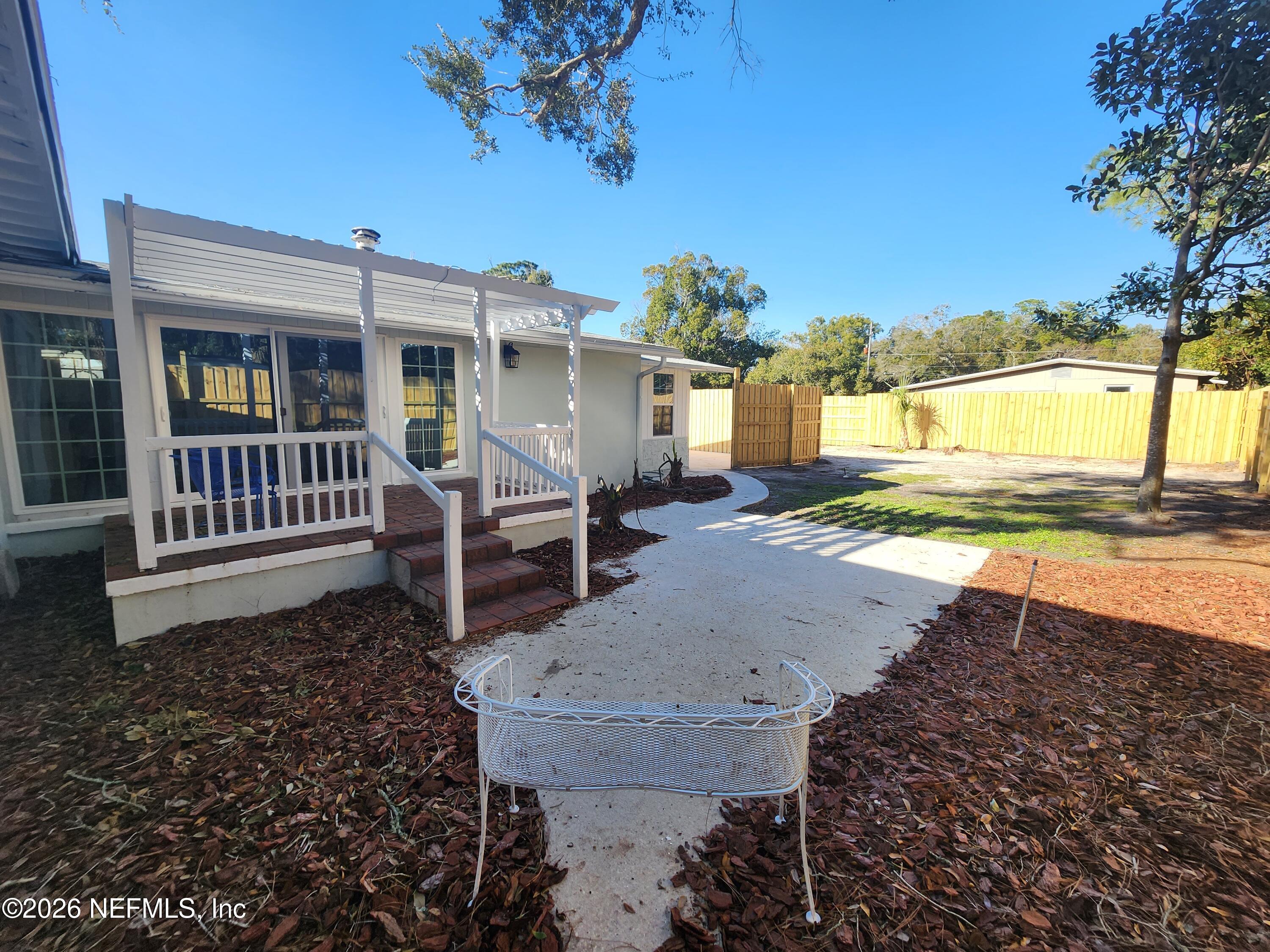 7269 Balboa Road Jacksonville, FL 32217 - Photo 21 of 24 a view of a house with backyard and sitting area
