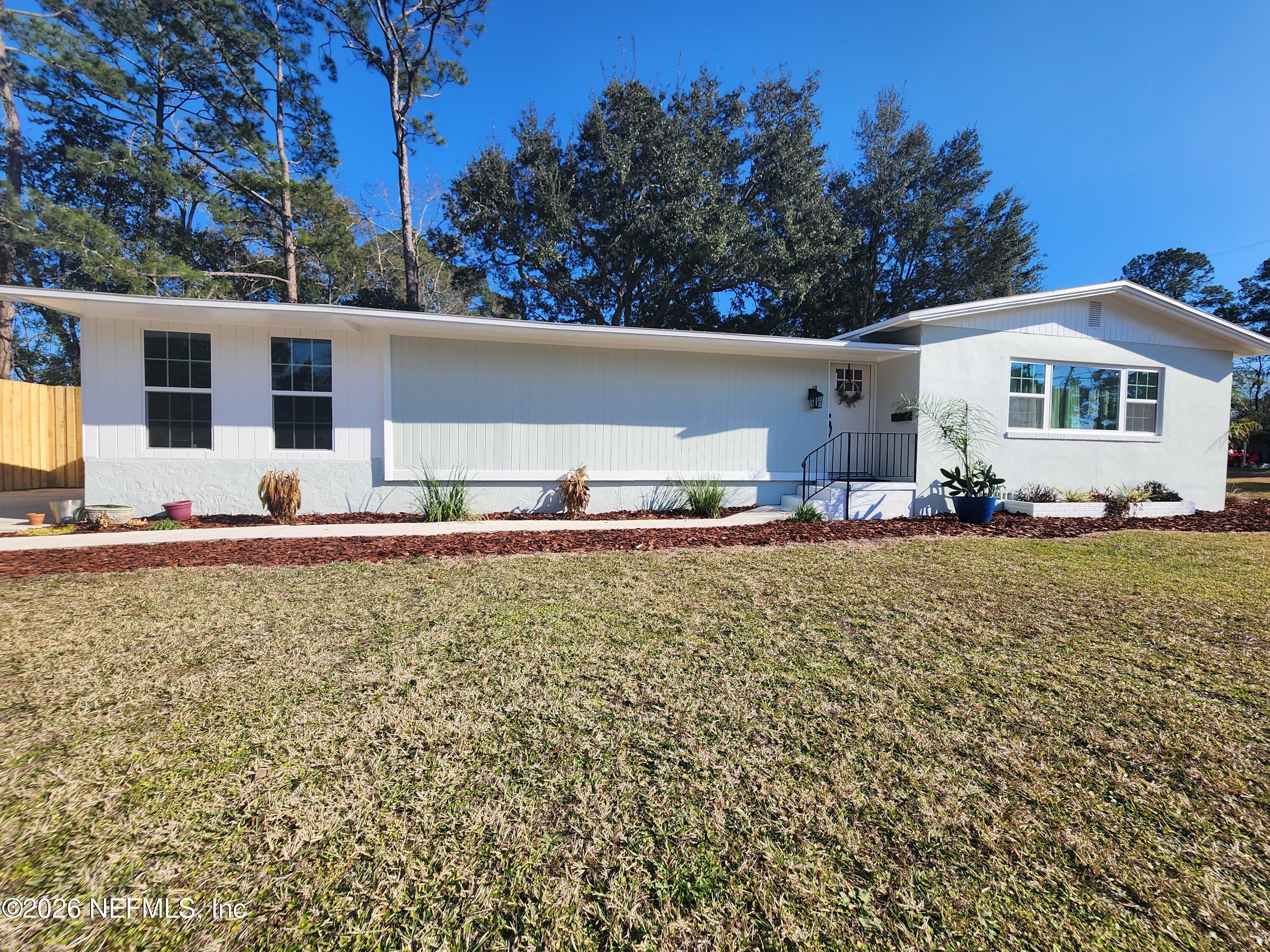 7269 Balboa Road Jacksonville, FL 32217 - Photo 24 of 24 a view of a house with a yard