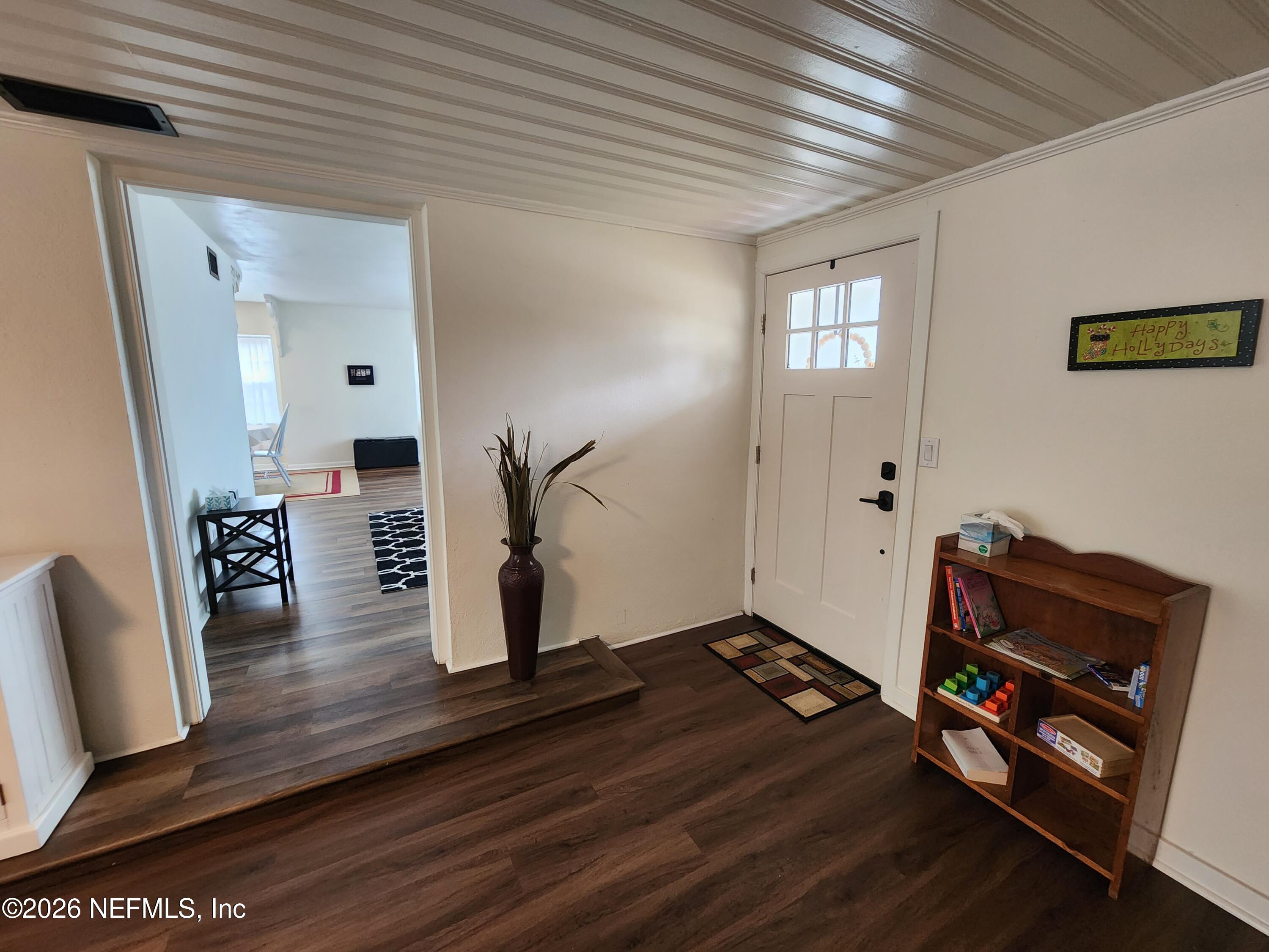 7269 Balboa Road Jacksonville, FL 32217 - Photo 3 of 24 a room with furniture and wooden floor