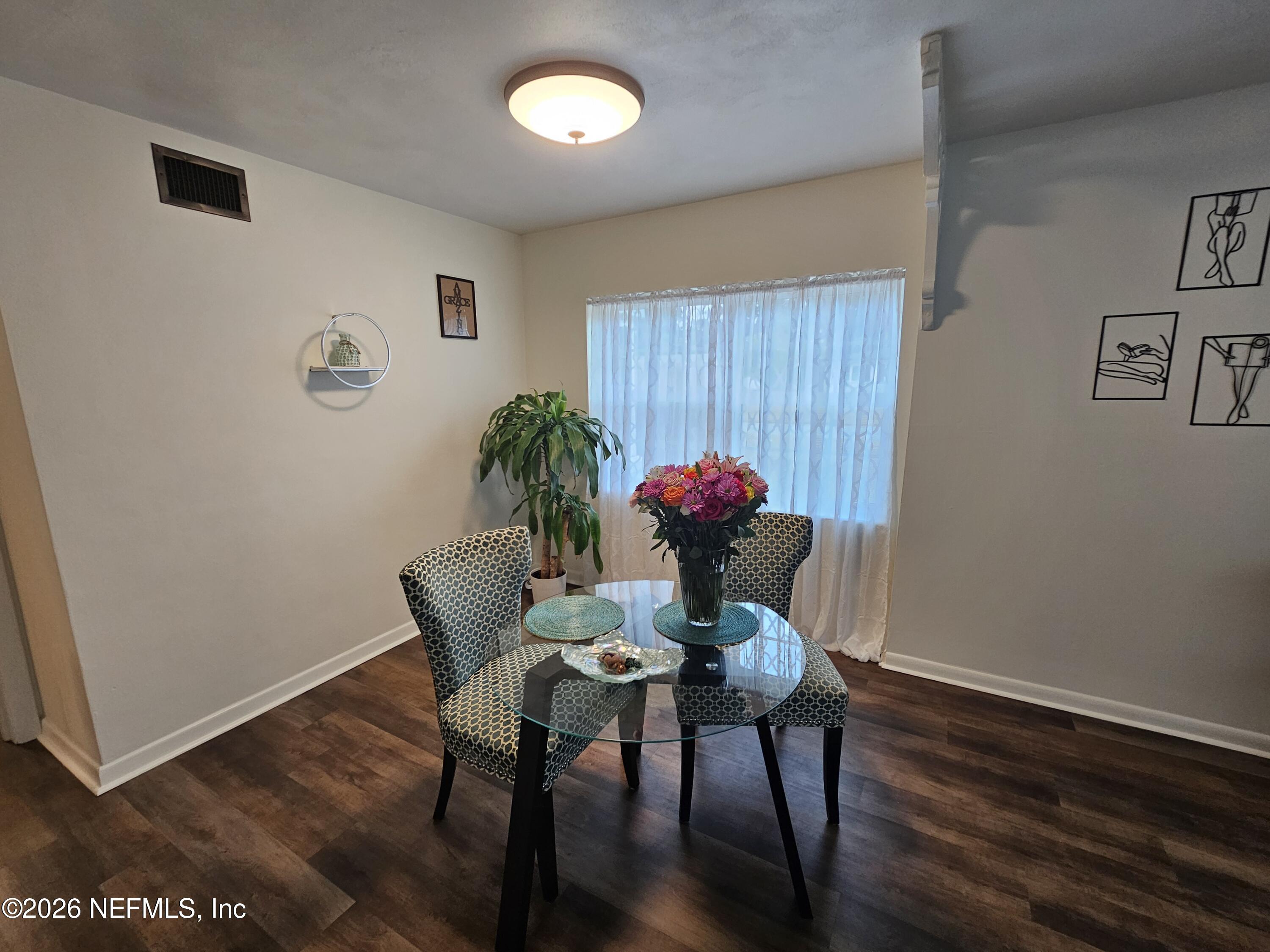 7269 Balboa Road Jacksonville, FL 32217 - Photo 9 of 24 a view of a room with furniture and wooden floor