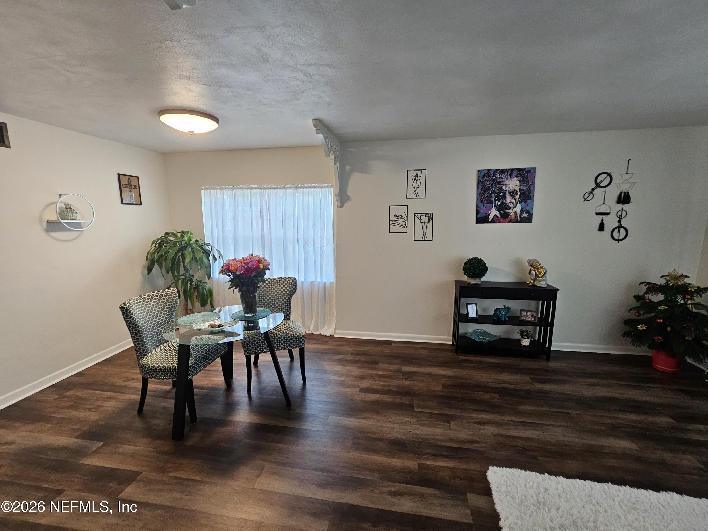 7269 Balboa Road Jacksonville, FL 32217 - Photo 10 of 24 a dining room with furniture and wooden floor