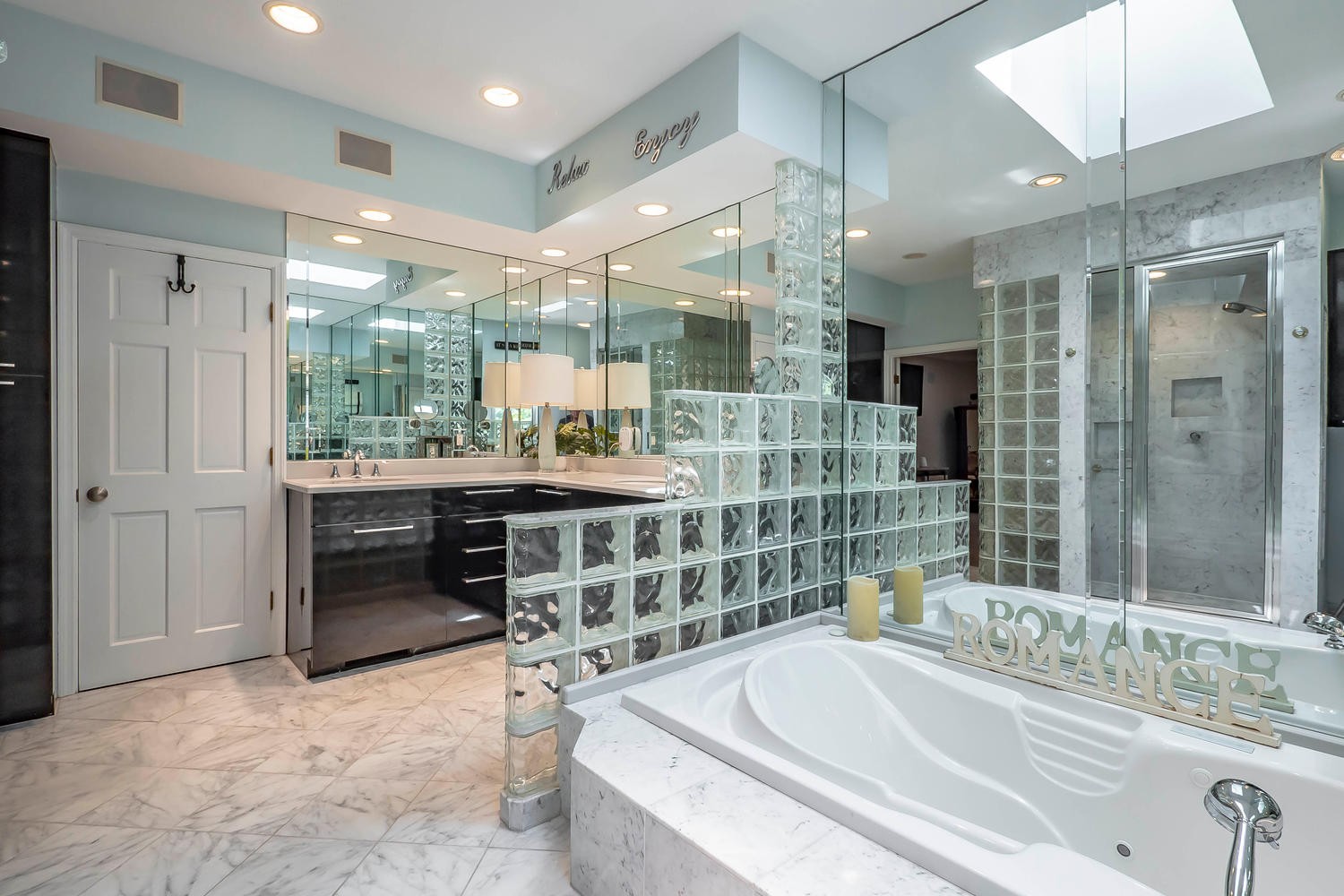 5922 Cane Ridge Road Antioch, TN 37013 - Photo 30 of 50 a bathroom with a tub a sink a mirror and a shower