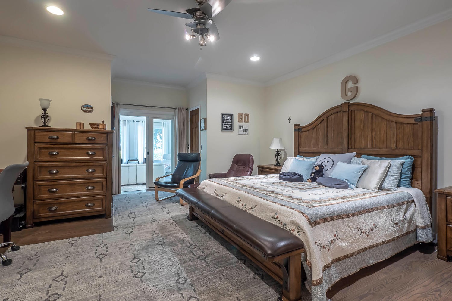 5922 Cane Ridge Road Antioch, TN 37013 - Photo 35 of 50 a bedroom with a bed and a chandelier