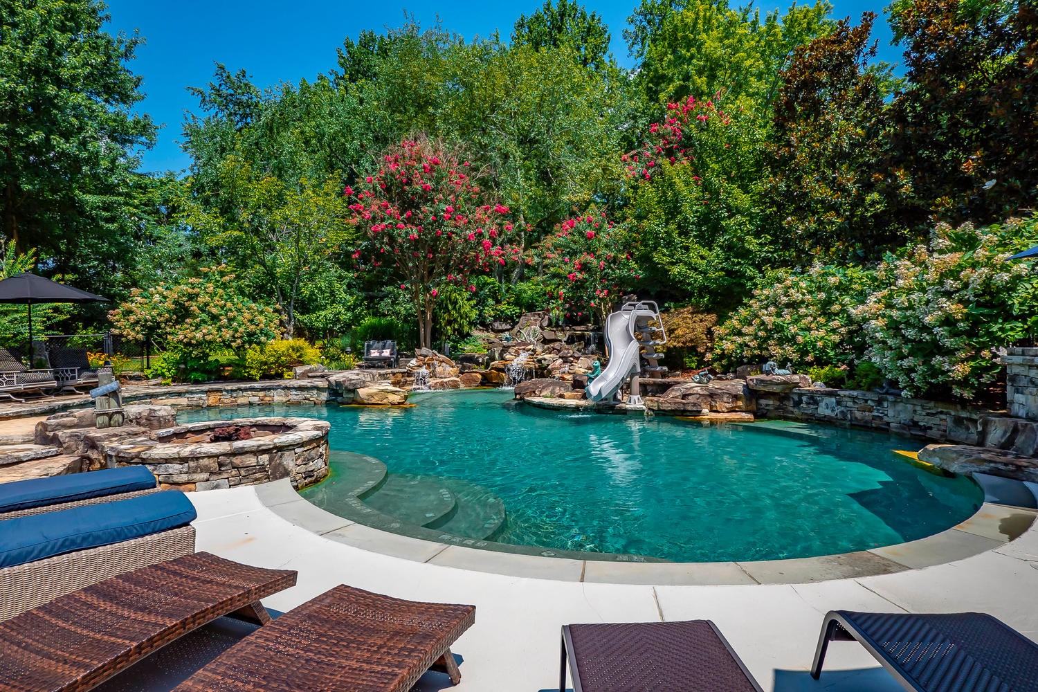 5922 Cane Ridge Road Antioch, TN 37013 - Photo 9 of 50 a view of a swimming pool and lounge chairs