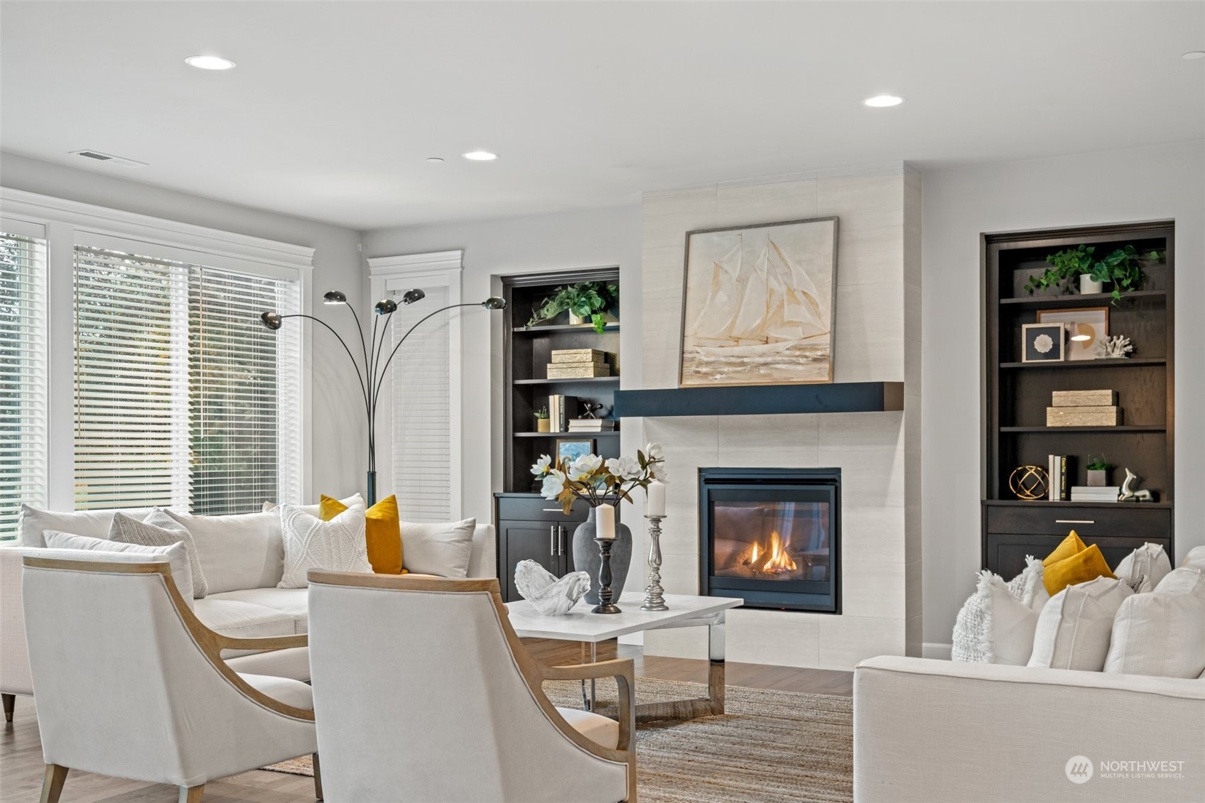 24213 1st Avenue Southeast Bothell, WA 98021 - Photo 14 of 32 a living room with furniture a fireplace and potted plants