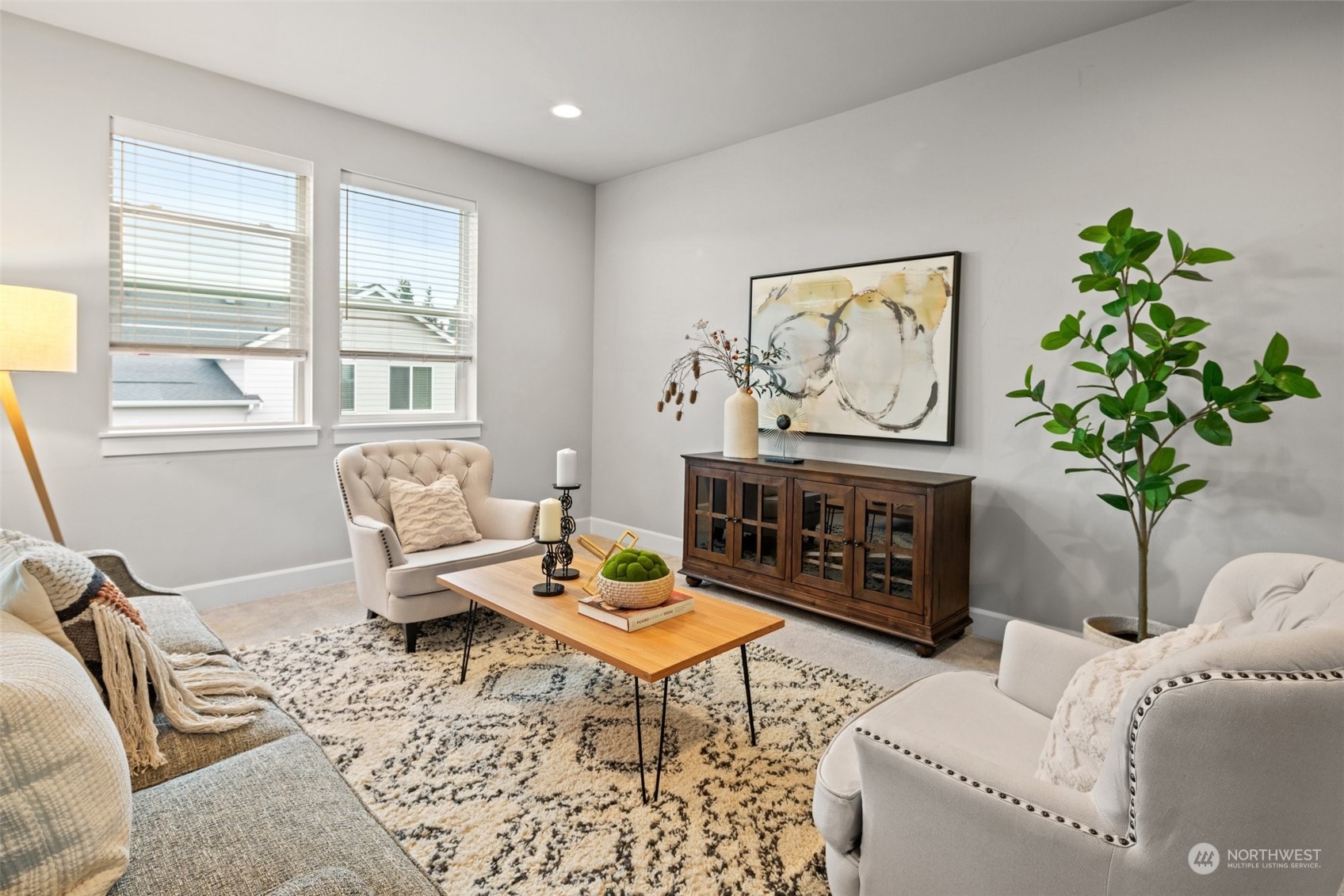 24213 1st Avenue Southeast Bothell, WA 98021 - Photo 19 of 32 a living room with furniture a fireplace and a potted plant