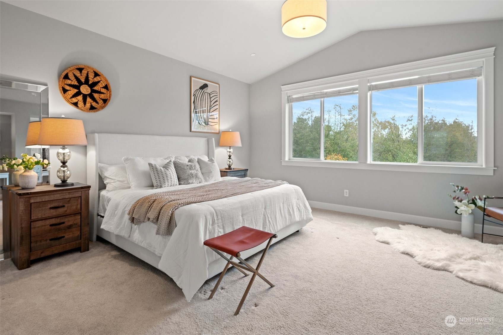 24213 1st Avenue Southeast Bothell, WA 98021 - Photo 20 of 32 a bedroom with a bed and a painting on the wall