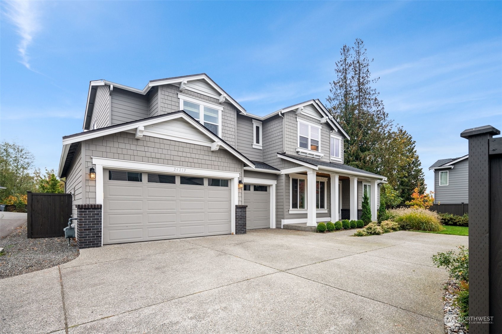 24213 1st Avenue Southeast Bothell, WA 98021 - Photo 2 of 32 a front view of a house with a garden
