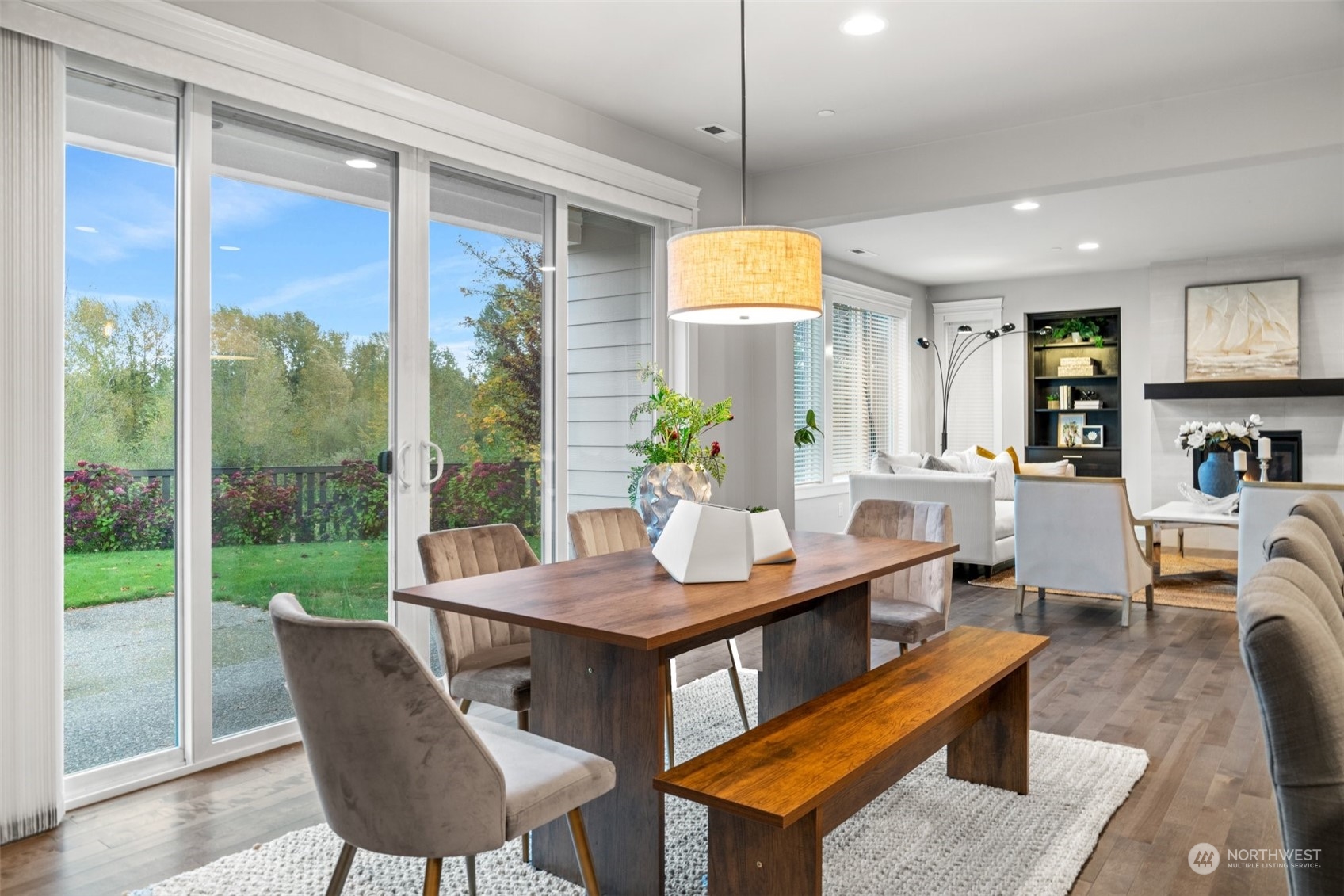 24213 1st Avenue Southeast Bothell, WA 98021 - Photo 8 of 32 a living room with furniture a flat screen tv and a large window