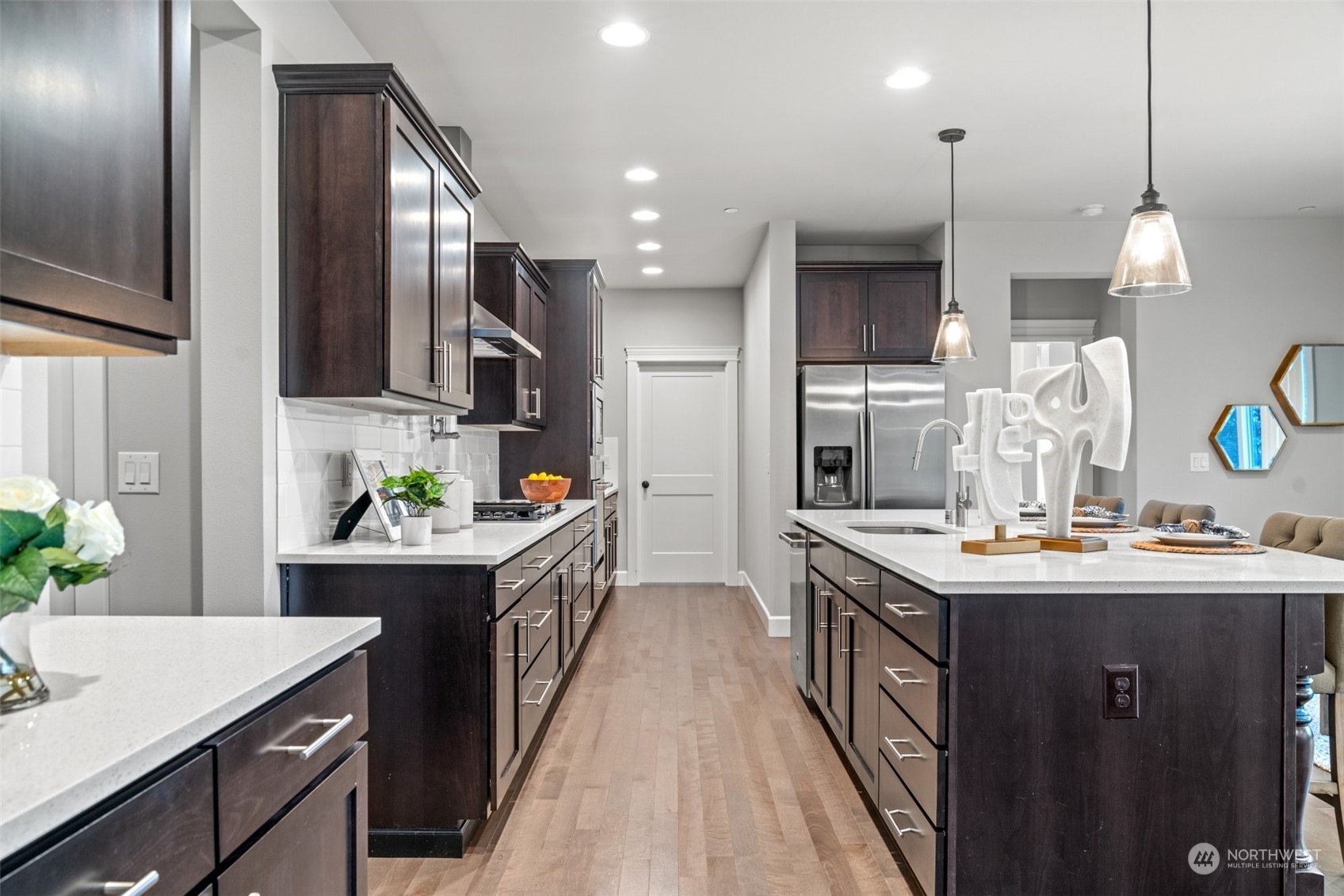 24213 1st Avenue Southeast Bothell, WA 98021 - Photo 10 of 32 a kitchen with kitchen island granite countertop a sink a counter top space stainless steel appliances and cabinets