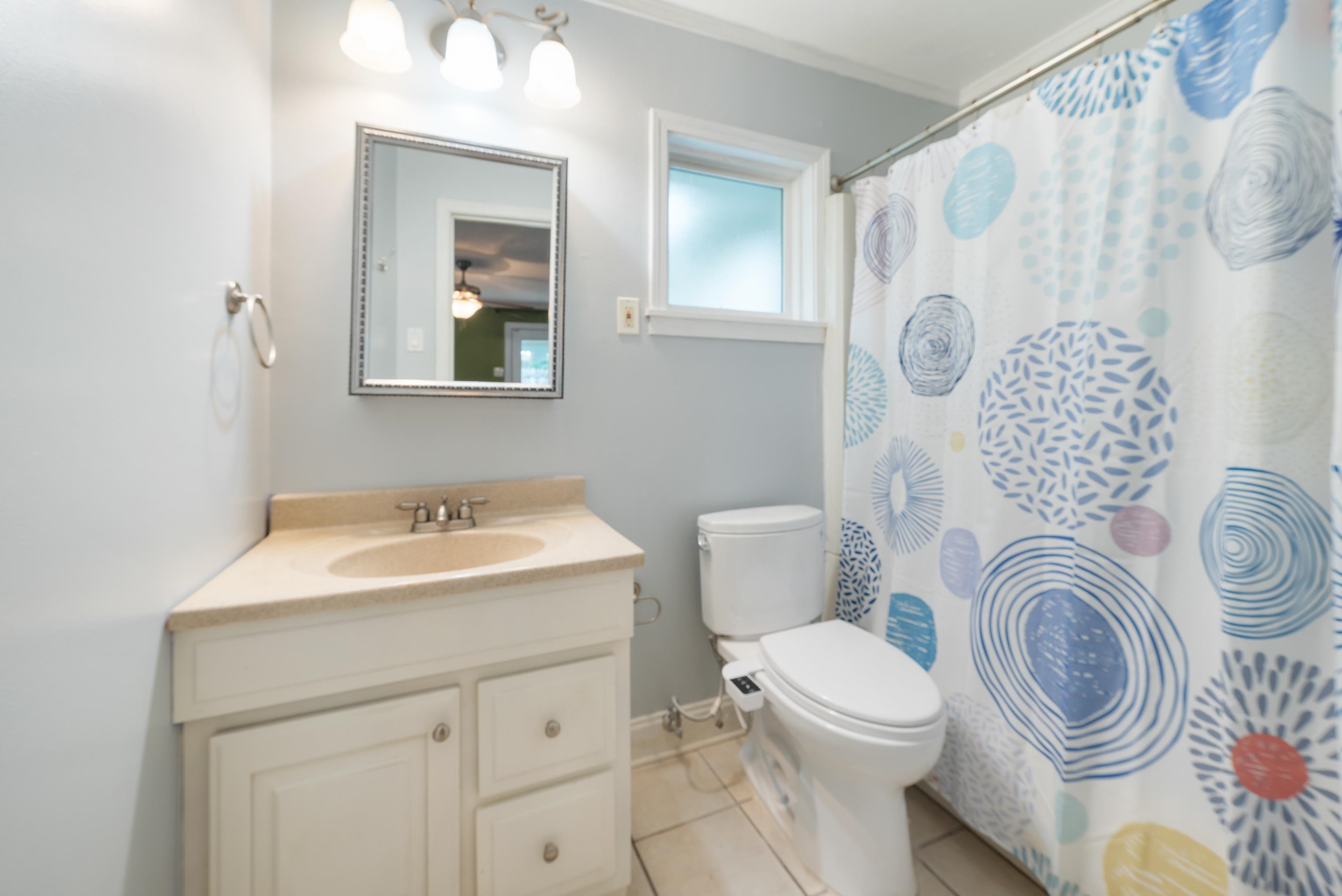 4461 Princeton Road Memphis, TN 38117 - Photo 20 of 33 a bathroom with a sink a toilet and a mirror
