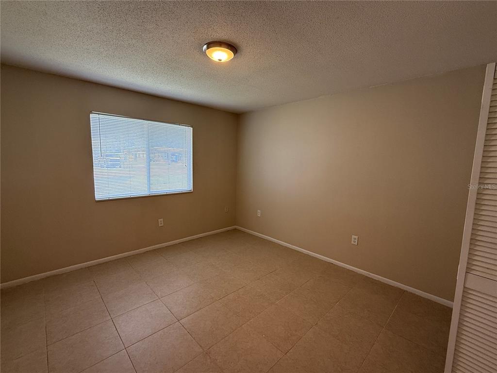 2744 Botts Landing Road, Unit 702 DeLand, FL 32720 - Photo 9 of 12 an empty room with a window