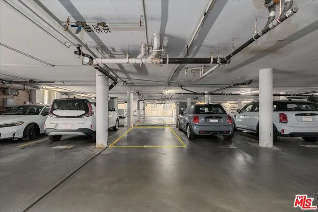 a view of parking garage with cars