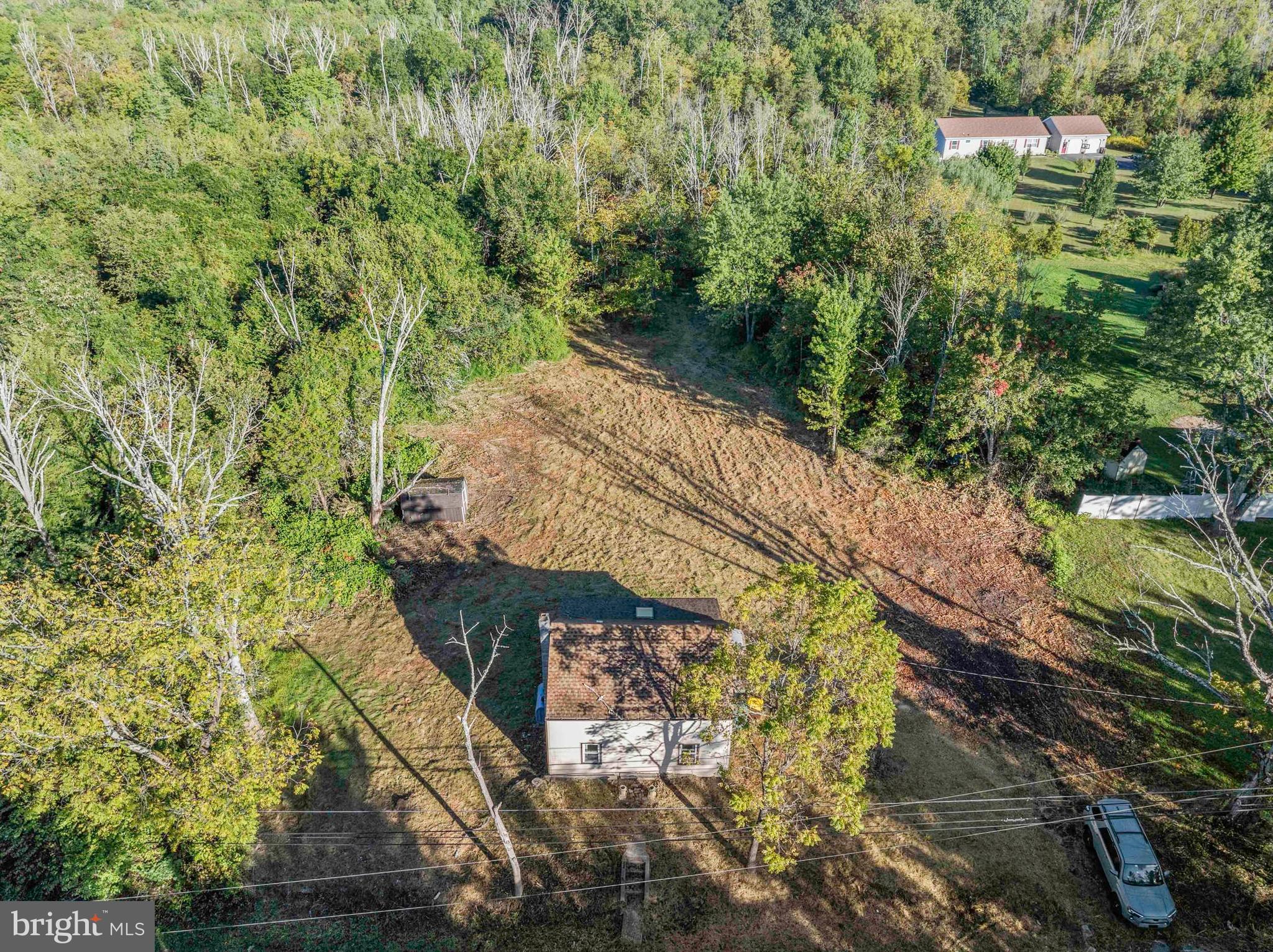 1270 Fennel Road Pennsburg, PA 18073 - Photo 18 of 18 a view of a yard with plants and wooden fence