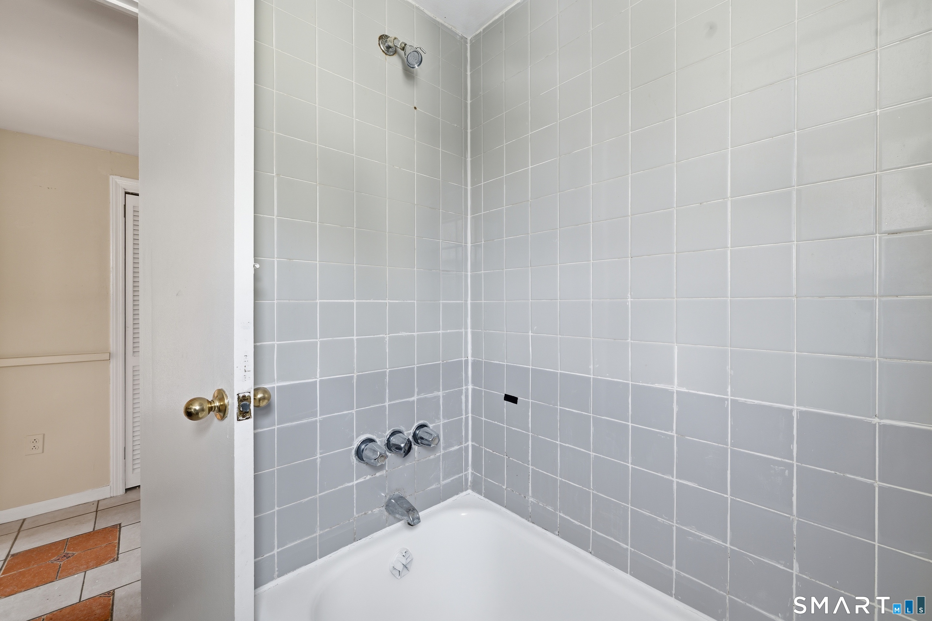 976 Capitol Avenue, Unit 3 Bridgeport, CT 06606 - Photo 11 of 12 a bathroom with a bathtub and shower