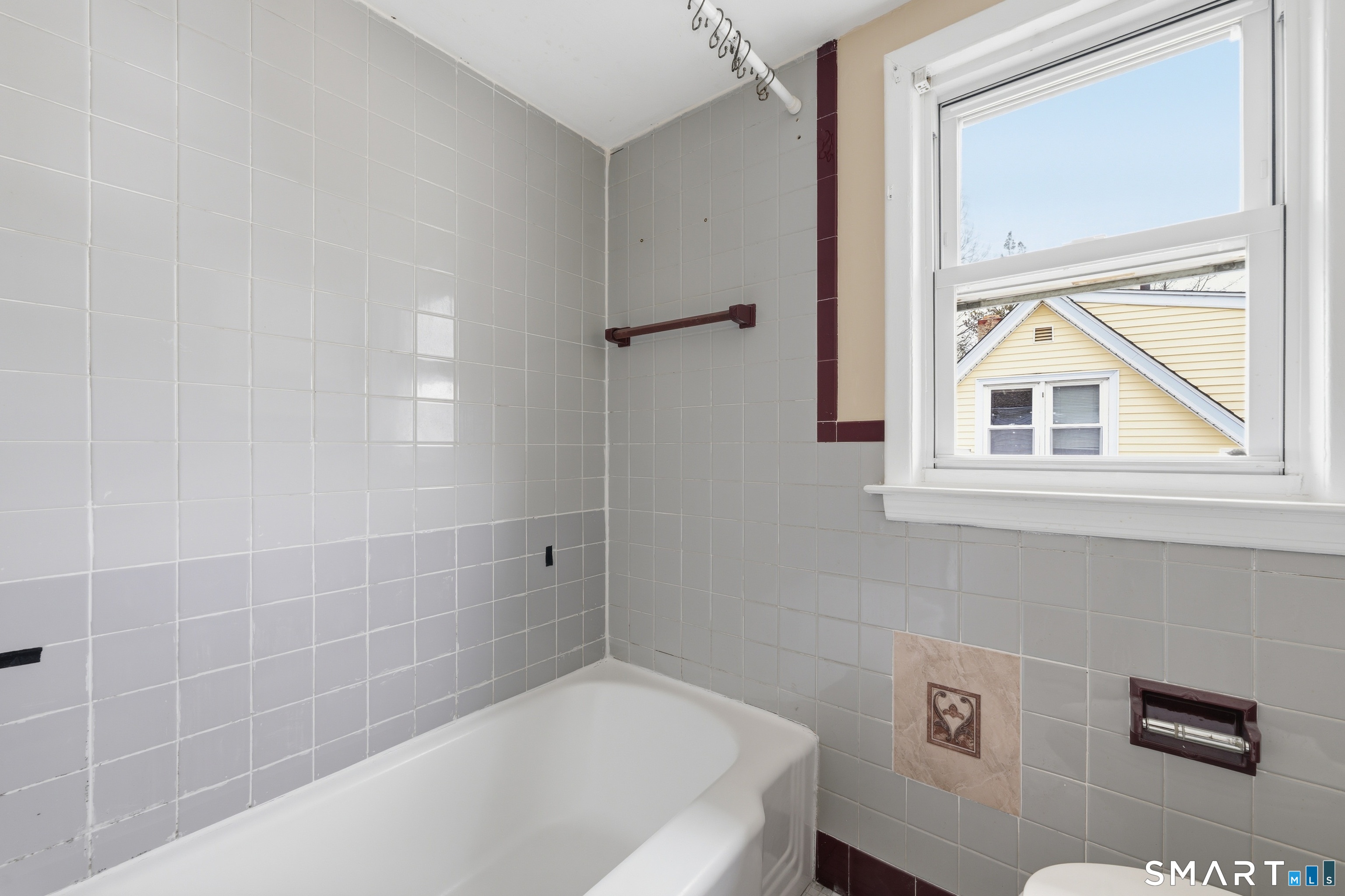 976 Capitol Avenue, Unit 3 Bridgeport, CT 06606 - Photo 12 of 12 a bathroom with a bathtub and a shower