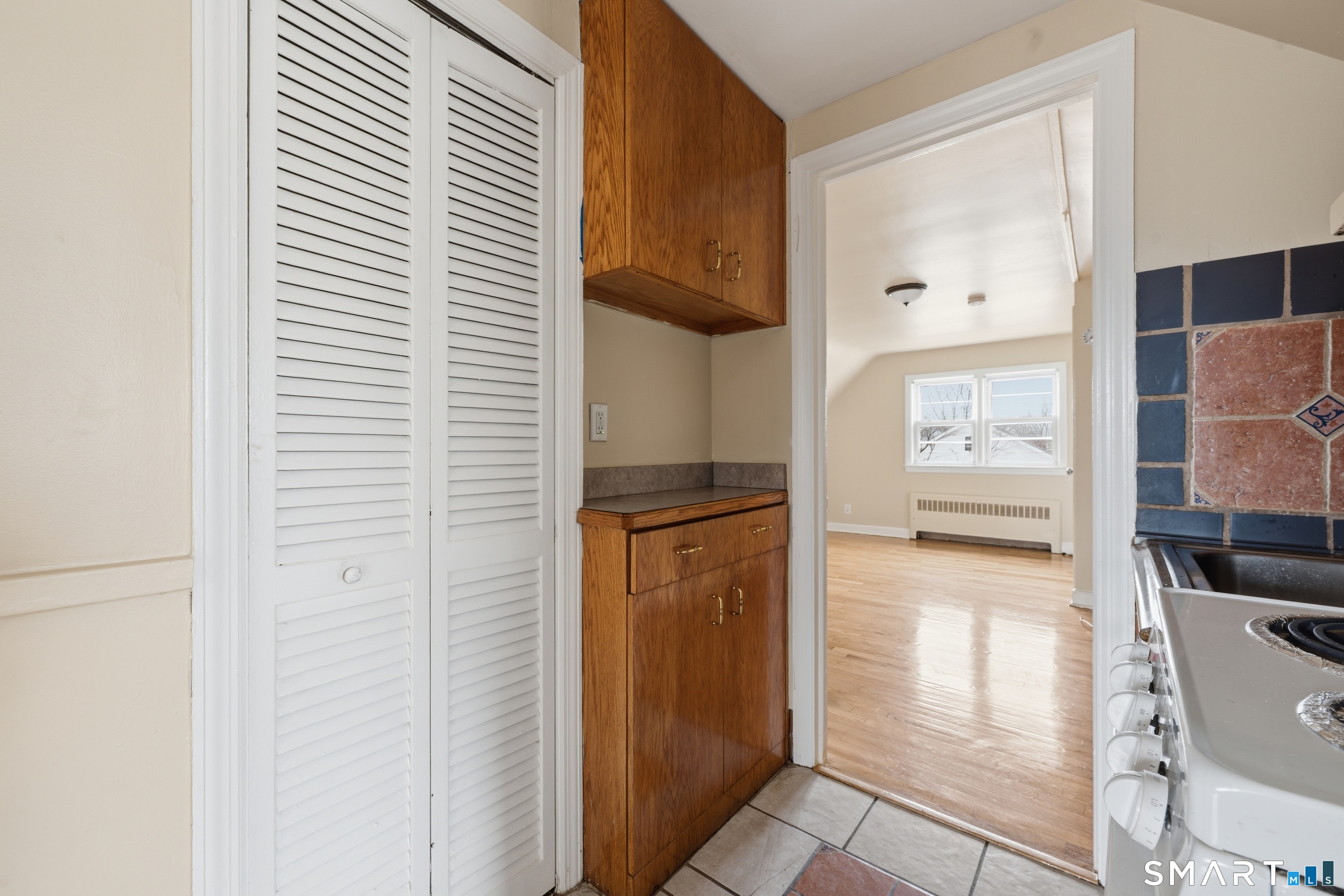 976 Capitol Avenue, Unit 3 Bridgeport, CT 06606 - Photo 5 of 12 a view of a hallway with dining area