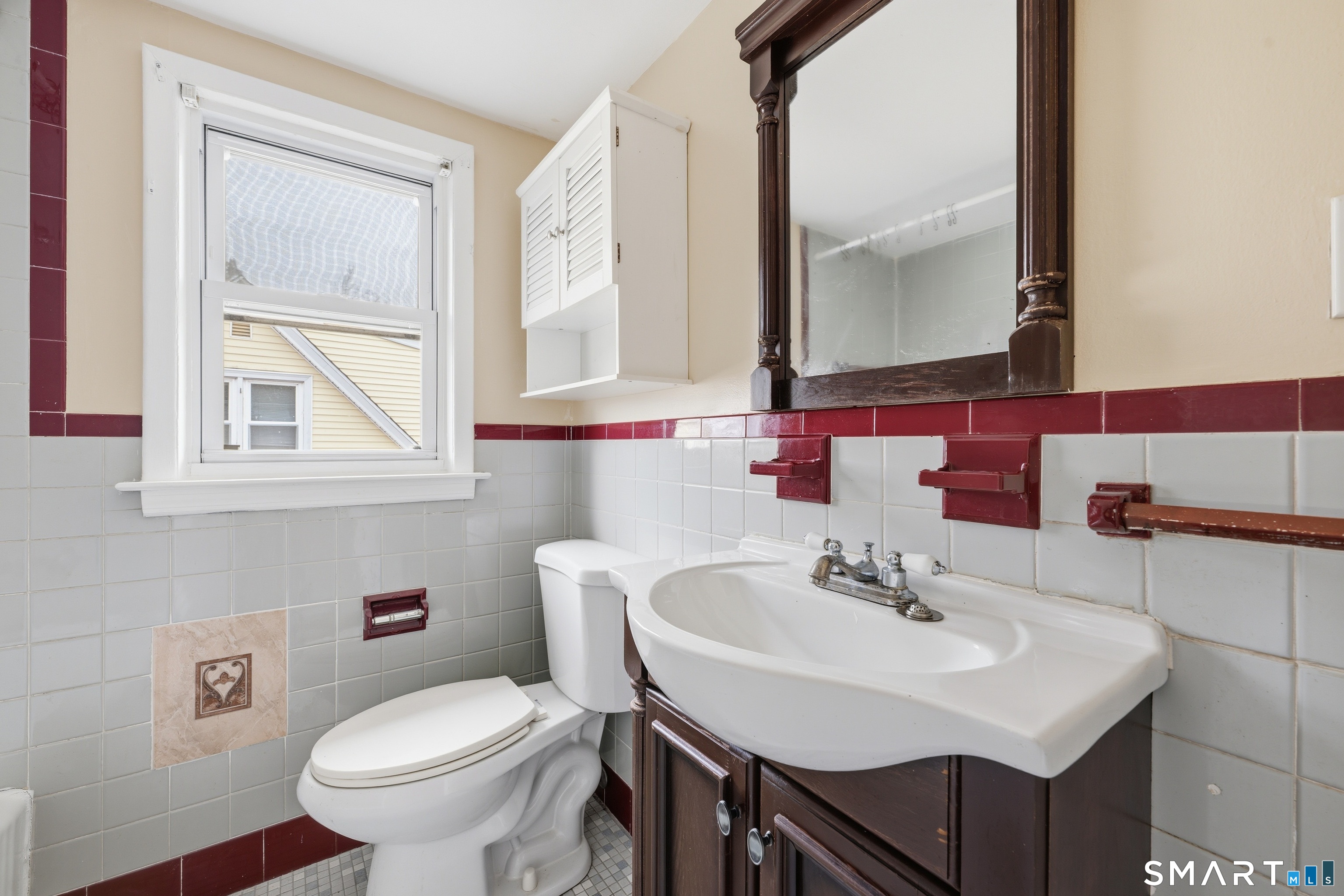 976 Capitol Avenue, Unit 3 Bridgeport, CT 06606 - Photo 10 of 12 a bathroom with a sink and a toilet