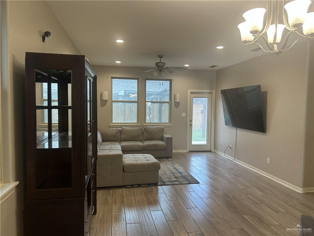 6317 Cascada Bnd Road McAllen, TX 78504 - Photo 4 of 4 a living room with furniture and a flat screen tv