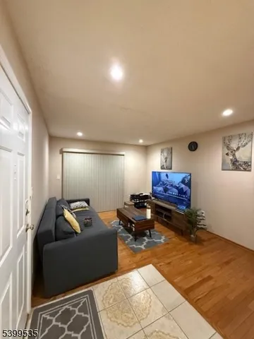 a living room with furniture and a rug