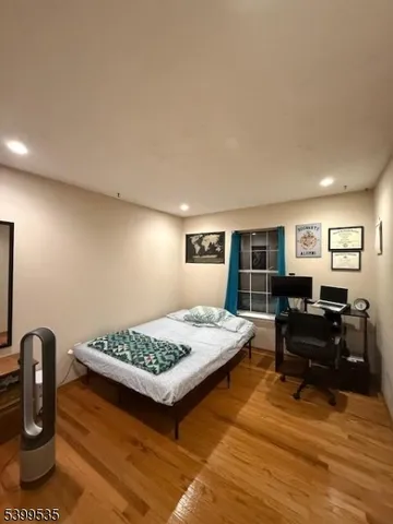 a living room with furniture rug and wooden floor