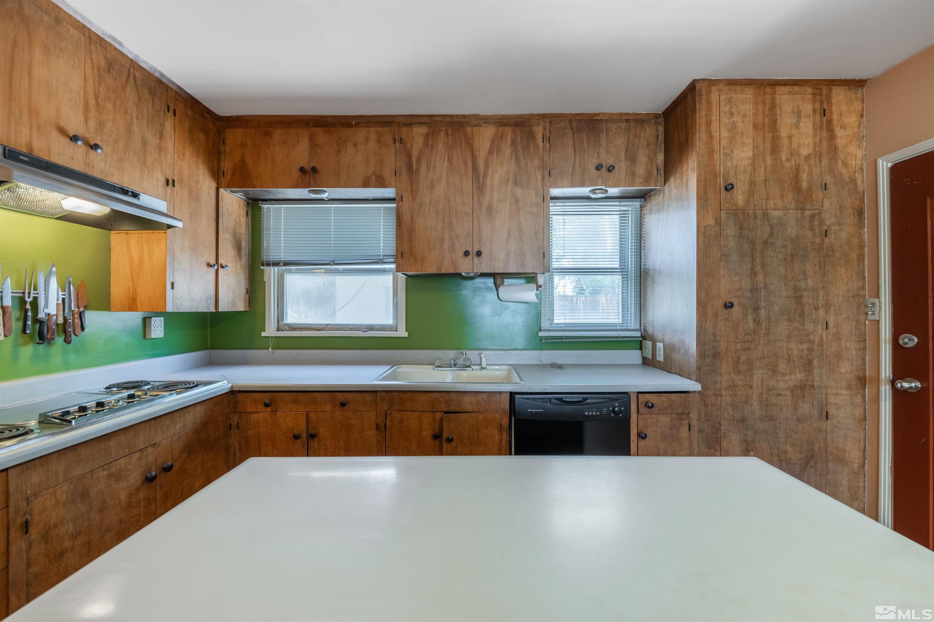 1279 Ridgeway Court Reno, NV 89503 - Photo 15 of 28 a kitchen with kitchen island sink and refrigerator