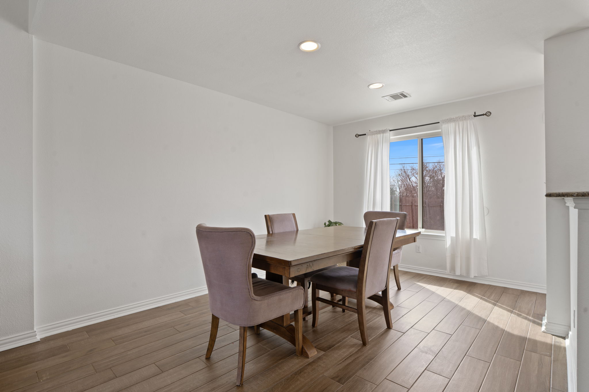 13109 Pealing Way Manor, TX 78653 - Photo 13 of 32 Dining area with wood finished floors and recessed lighting