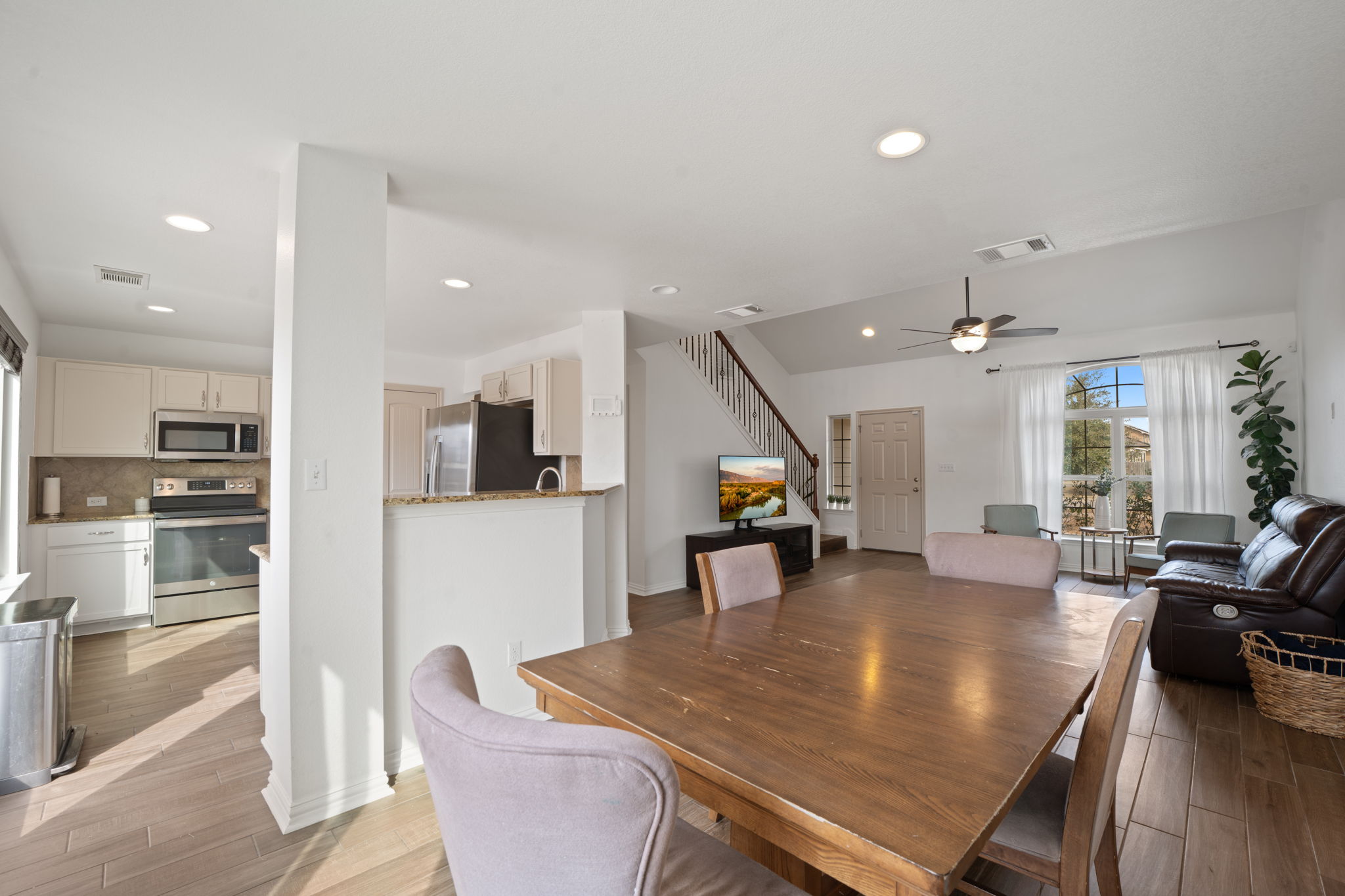 13109 Pealing Way Manor, TX 78653 - Photo 14 of 32 Dining space featuring wood finish floors, ceiling fan, and recessed lighting