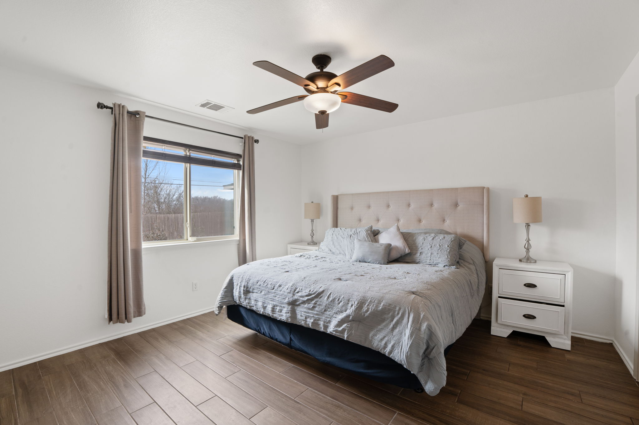 13109 Pealing Way Manor, TX 78653 - Photo 15 of 32 Bedroom featuring dark wood-type flooring and ceiling fan