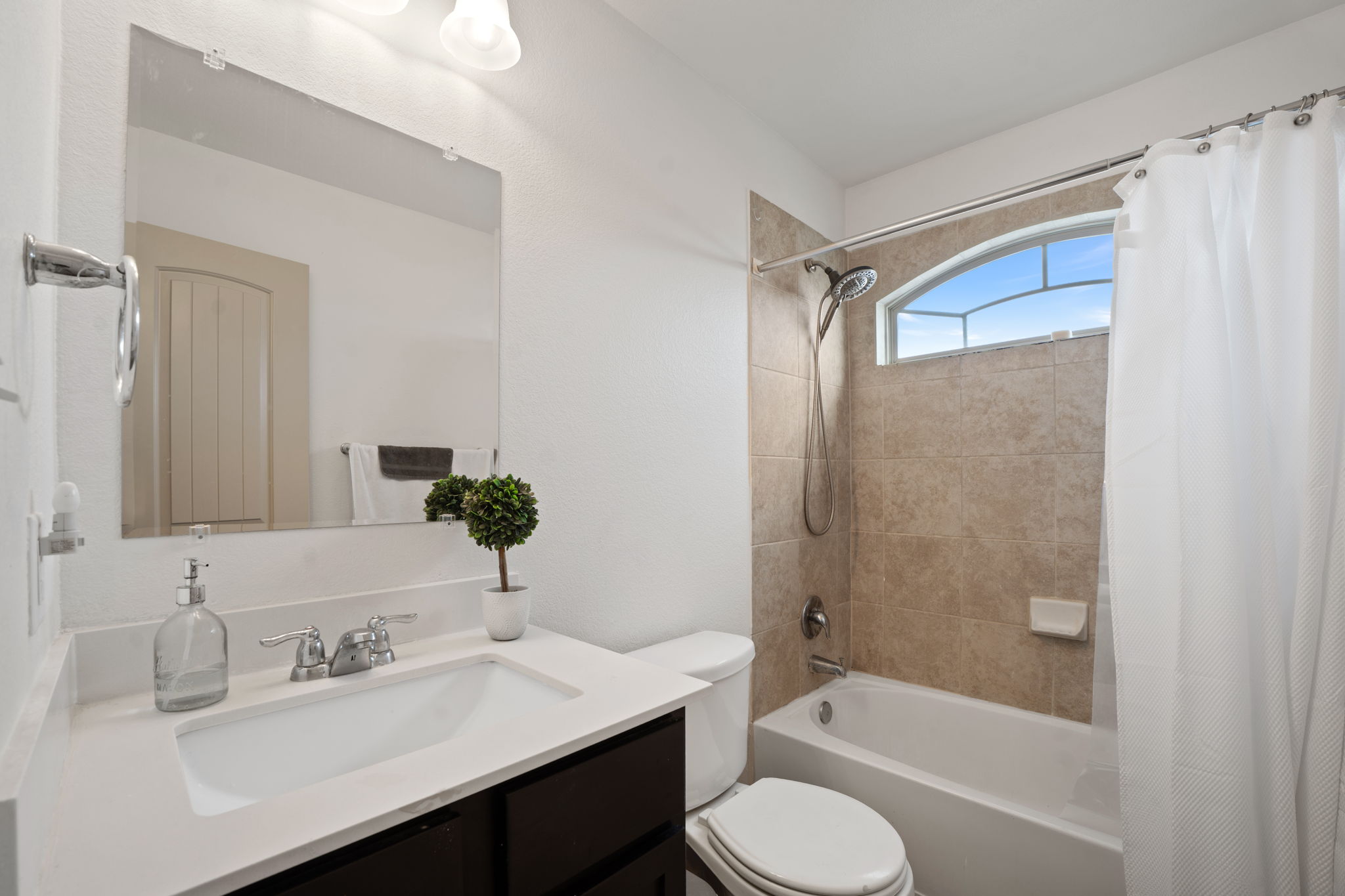 13109 Pealing Way Manor, TX 78653 - Photo 23 of 32 Bathroom featuring vanity and shower / tub combo with curtain