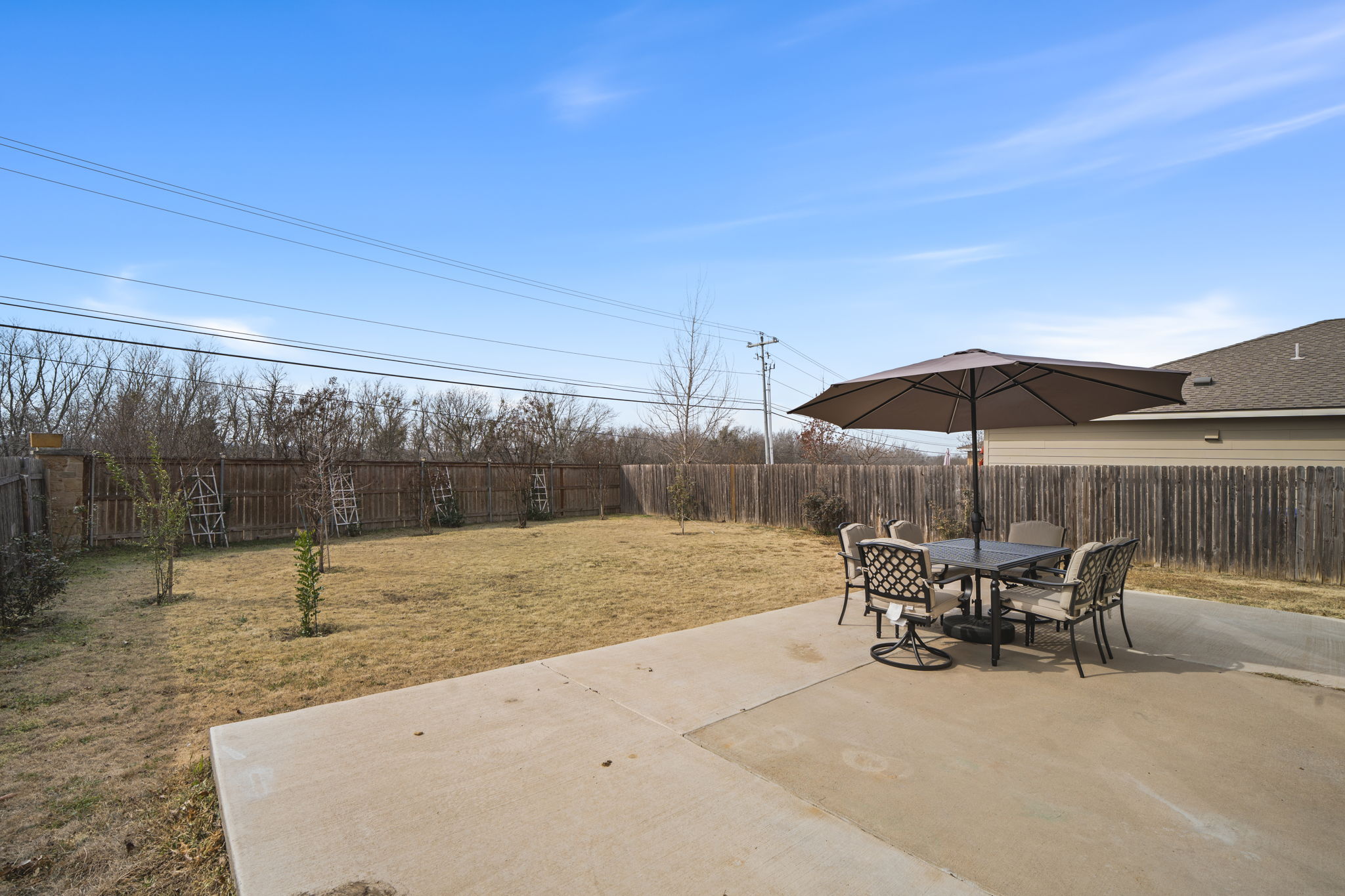 13109 Pealing Way Manor, TX 78653 - Photo 28 of 32 Fenced backyard with outdoor dining area and a patio