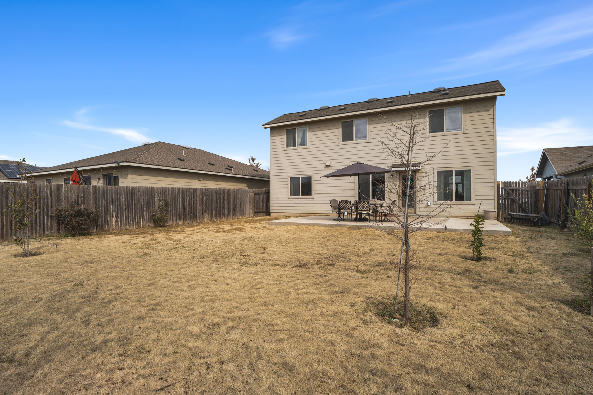 13109 Pealing Way Manor, TX 78653 - Photo 29 of 32 Back of property featuring a patio and a fenced backyard