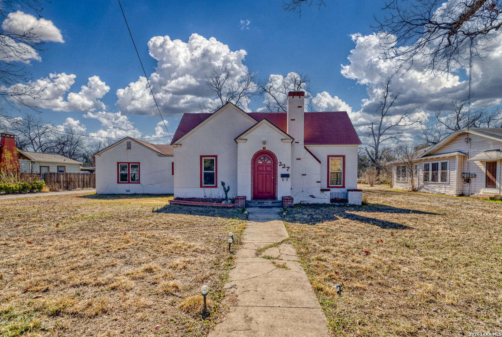 227 West Mueller Street Uvalde, TX 78801 - Photo 2 of 27 a view of a house with a yard