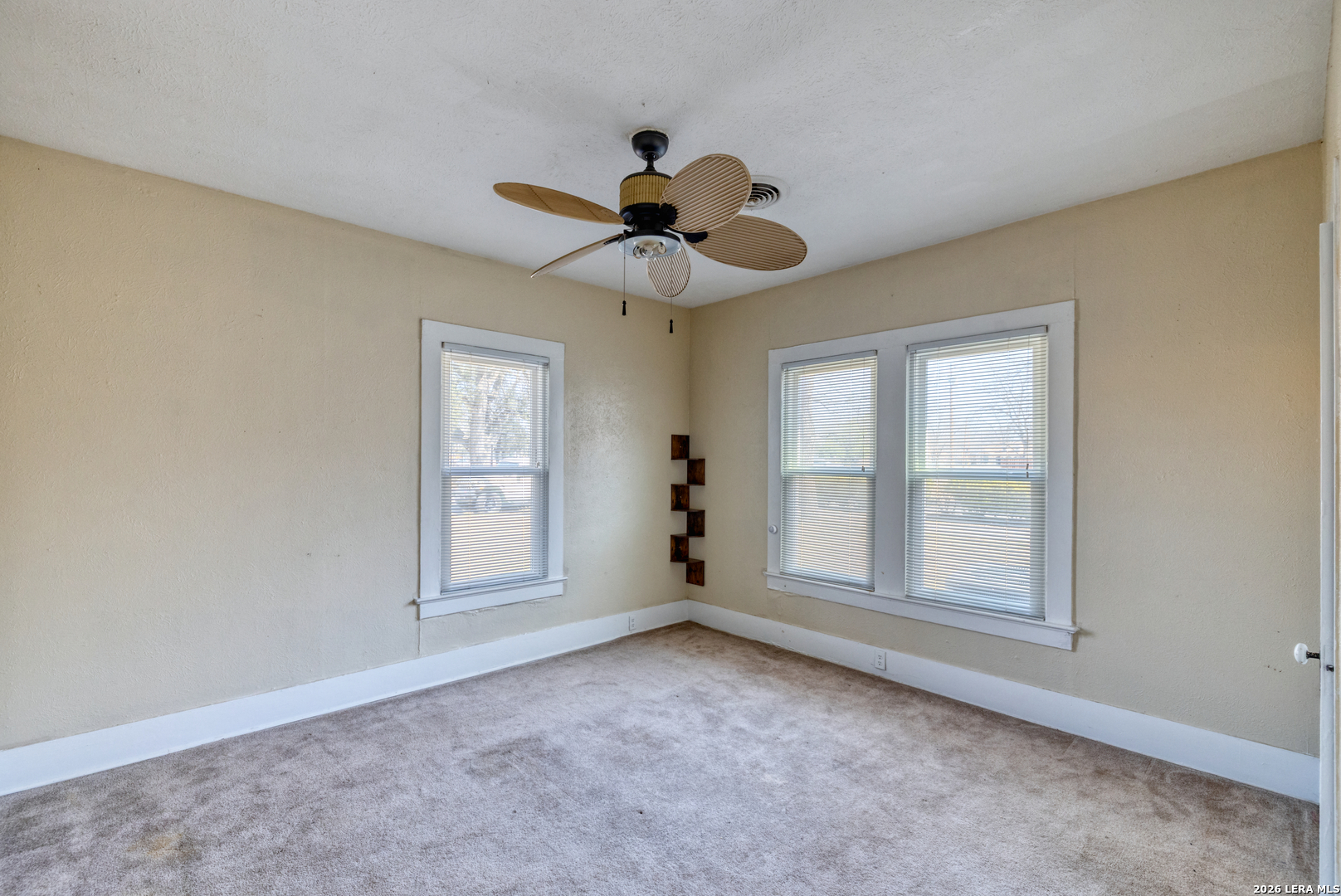 227 West Mueller Street Uvalde, TX 78801 - Photo 21 of 27 a view of an empty room with a window