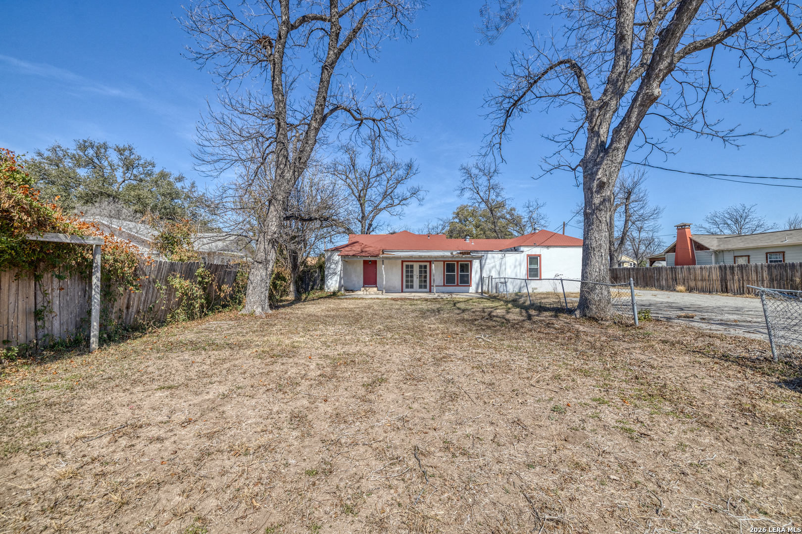 227 West Mueller Street Uvalde, TX 78801 - Photo 22 of 27 a front view of a house with a yard