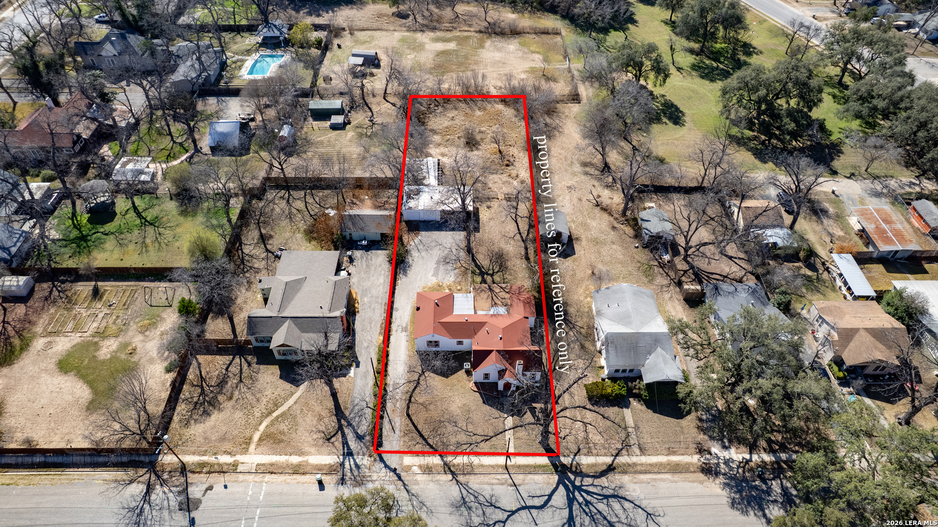 227 West Mueller Street Uvalde, TX 78801 - Photo 26 of 27 an aerial view of residential houses with outdoor space