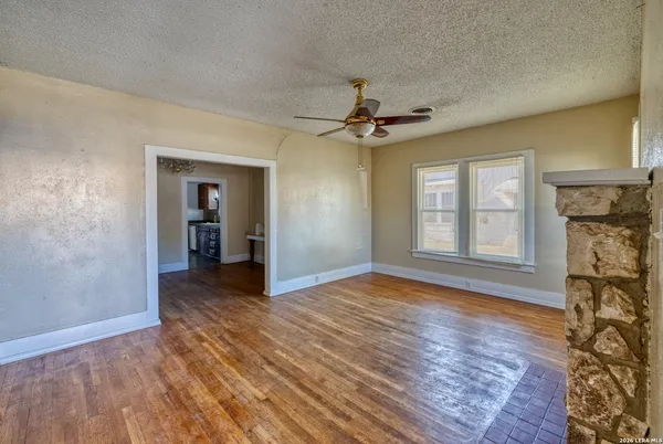 a view of livingroom with hardwood floor and a ceiling fan