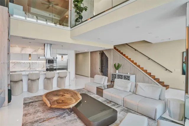 a view of a living room and floor to ceiling window or dining room