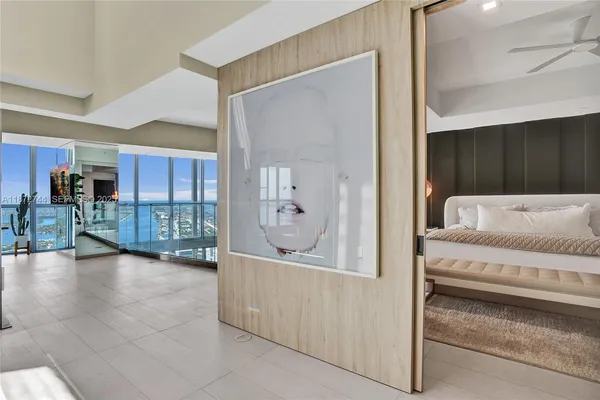 a bedroom with a bed and a table