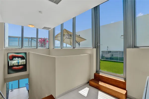 an aerial view of a house with a ocean view
