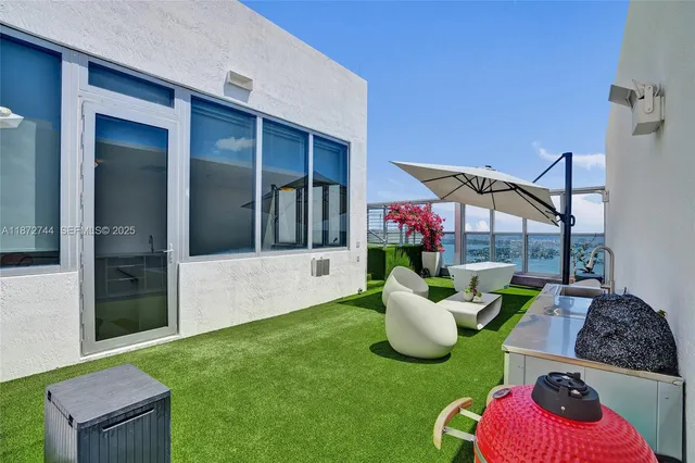 a kitchen with a refrigerator and a sink