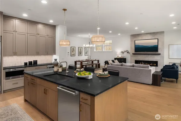 a kitchen with sink stove and cabinets