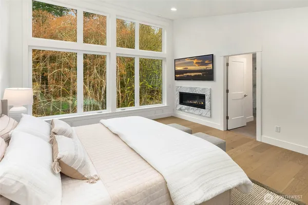 a bedroom with a bed and a fireplace
