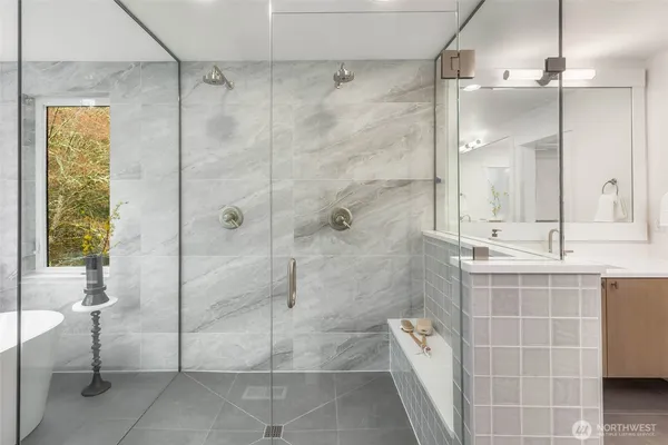 a bathroom with a shower and a sink