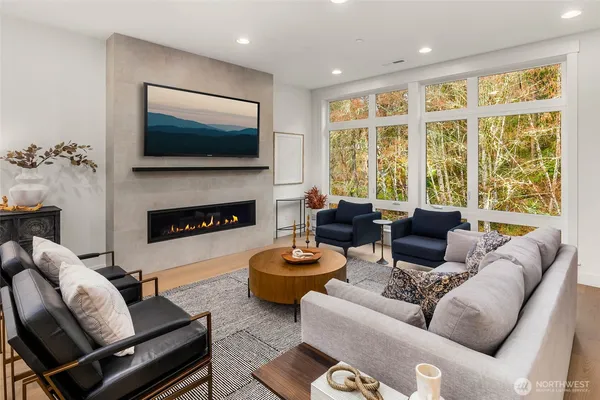 a living room with furniture fireplace and a flat screen tv