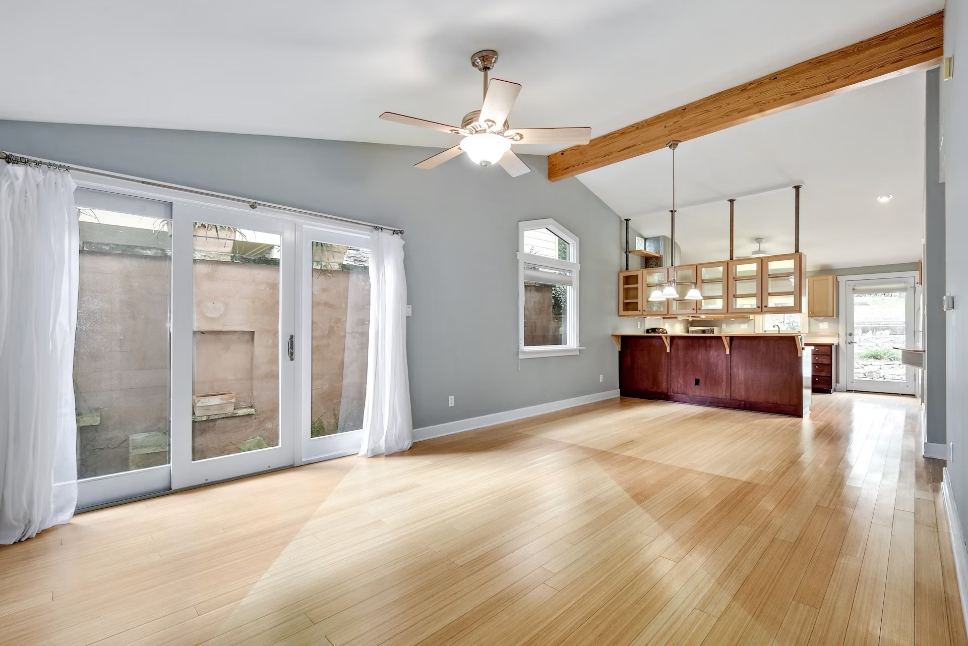 Exposed beam accents this open-concept main living space.